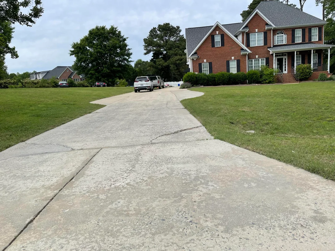 Dirty driveway before cleaning